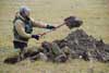 Gosha Matyshak digging a soil pit at Vaskiny Dachi.