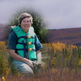 Edie Barbour, on the river; background is, I dunno, somewhere in Alaska